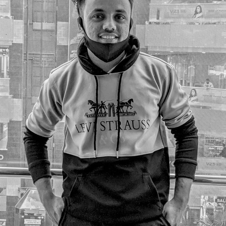 Alex Reed, Lead Design Curator at Frosted Stream Platform, reviewing corporate floral arrangements